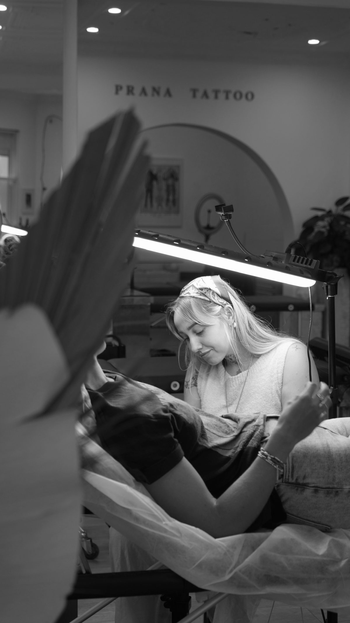 Caroline Lindskov tattooing a client at Prana Tattoo studio