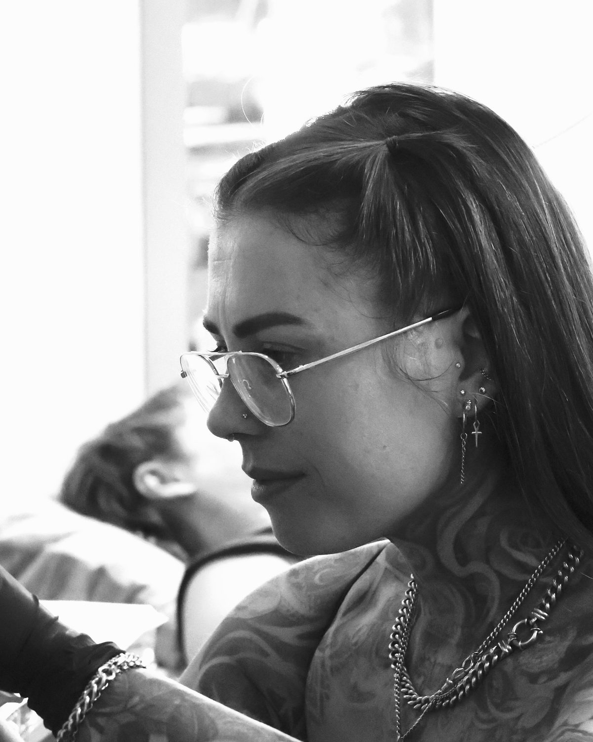 Portrait of Charlie Lund tattooing at Prana Tattoo, fine line and ornamental blackwork artist