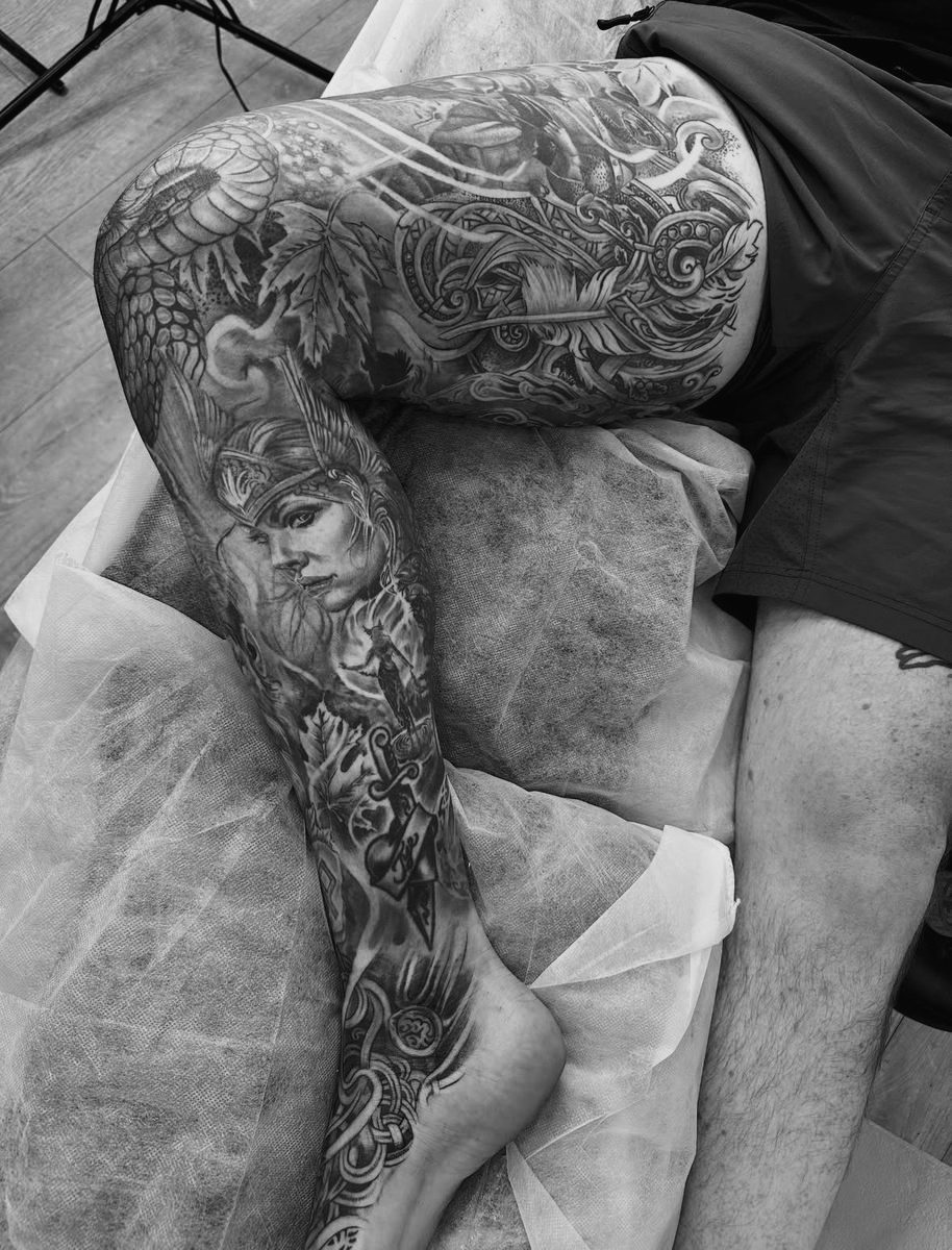 Norse mythology leg sleeve tattoo with valkyrie portrait by Charlie Lund