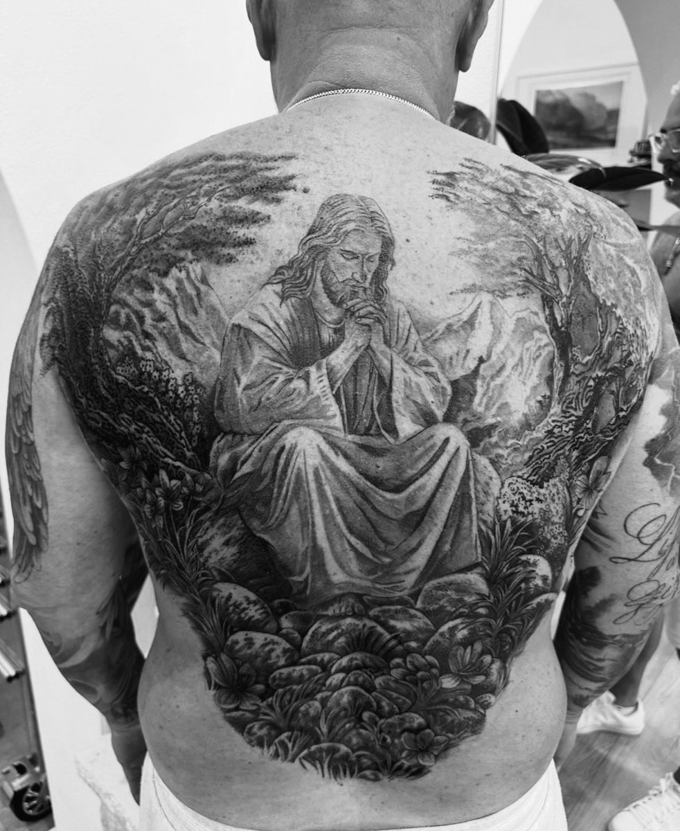 Full back tattoo of Christ in Gethsemane in black and grey realism by Charlie Lund