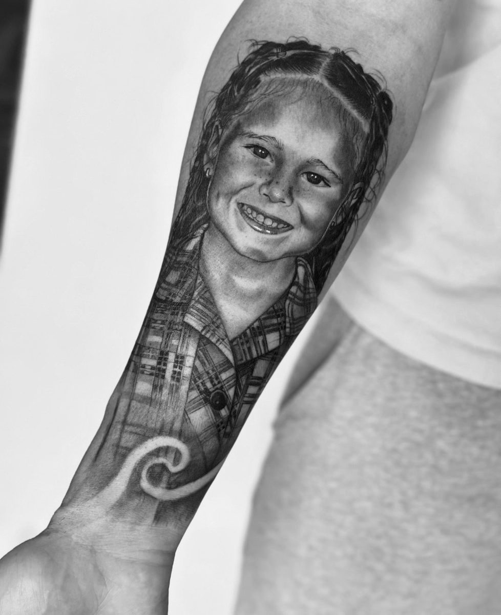 Portrait of a young girl forearm tattoo in fine line realism by Charlie Lund