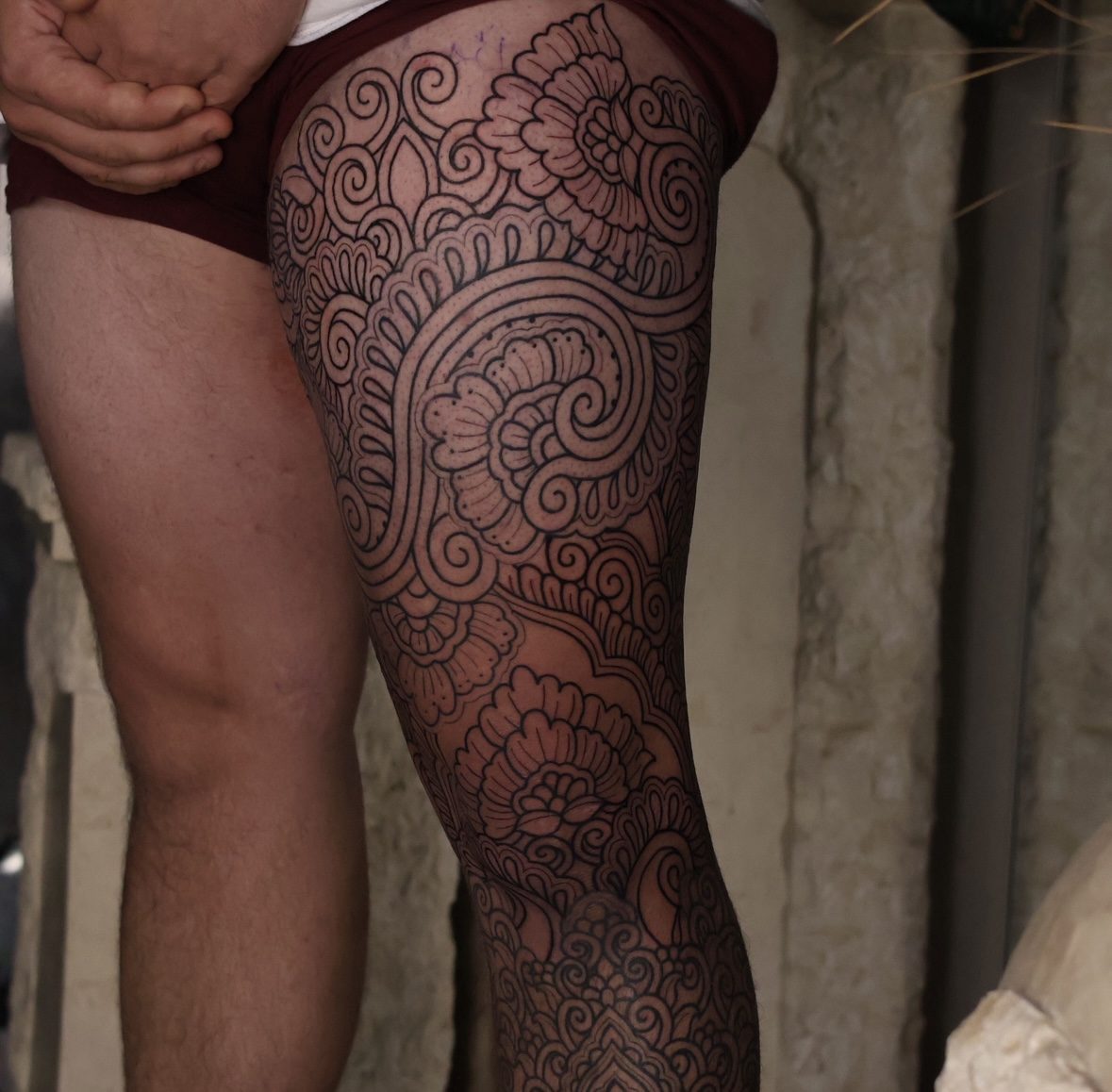 Ornamental floral leg sleeve tattoo in fine linework by Josh Marx