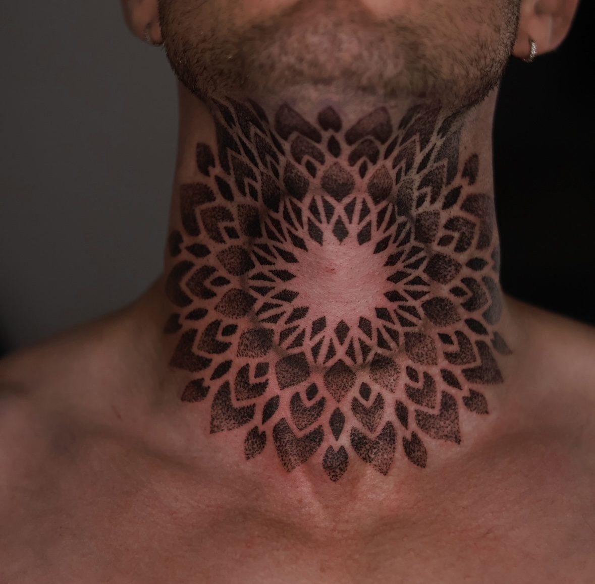 Symmetrical blackwork ornamental tattoo by Josh Marx