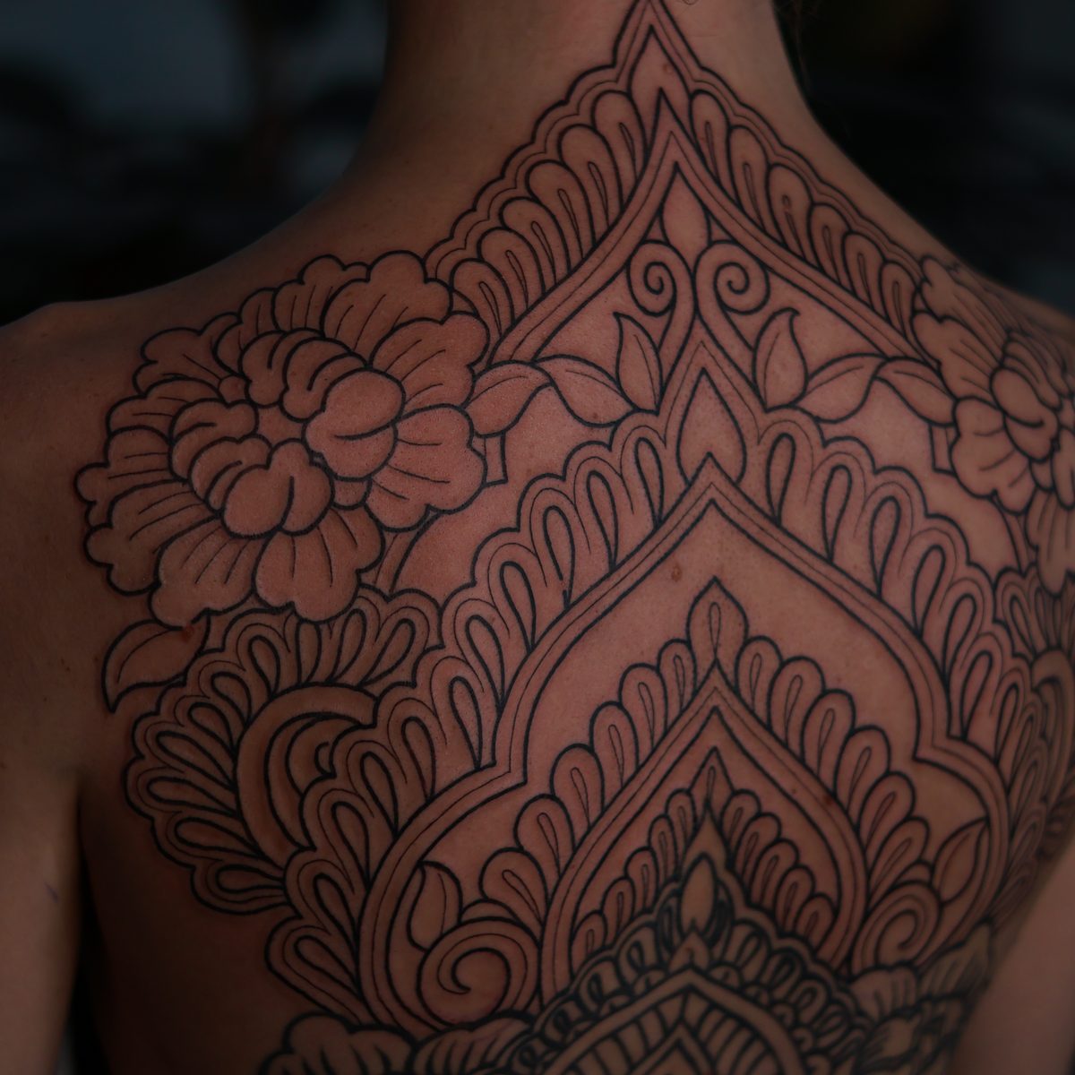 Symmetrical fine line tattoo by Josh Marx
